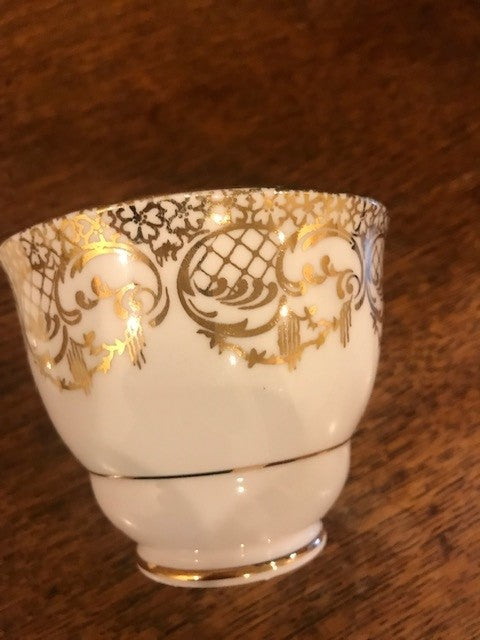 Pretty white and gold cup and saucer