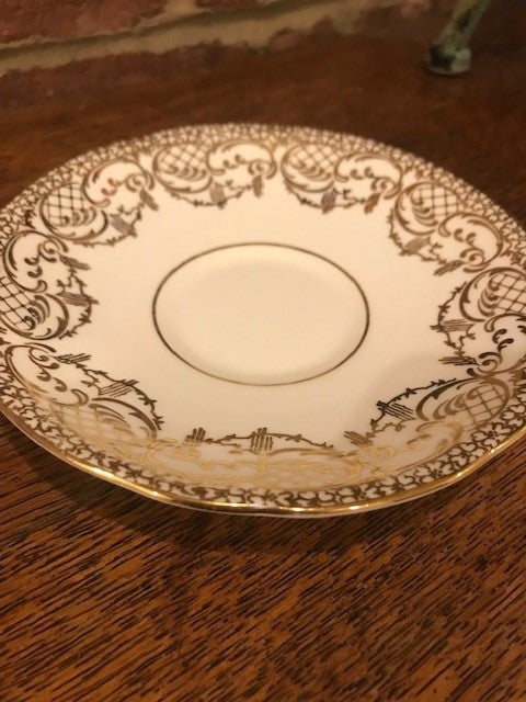 Pretty white and gold cup and saucer