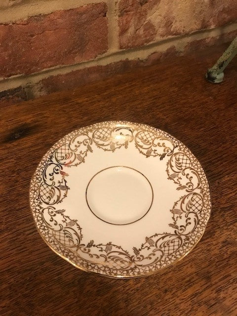 Pretty white and gold cup and saucer